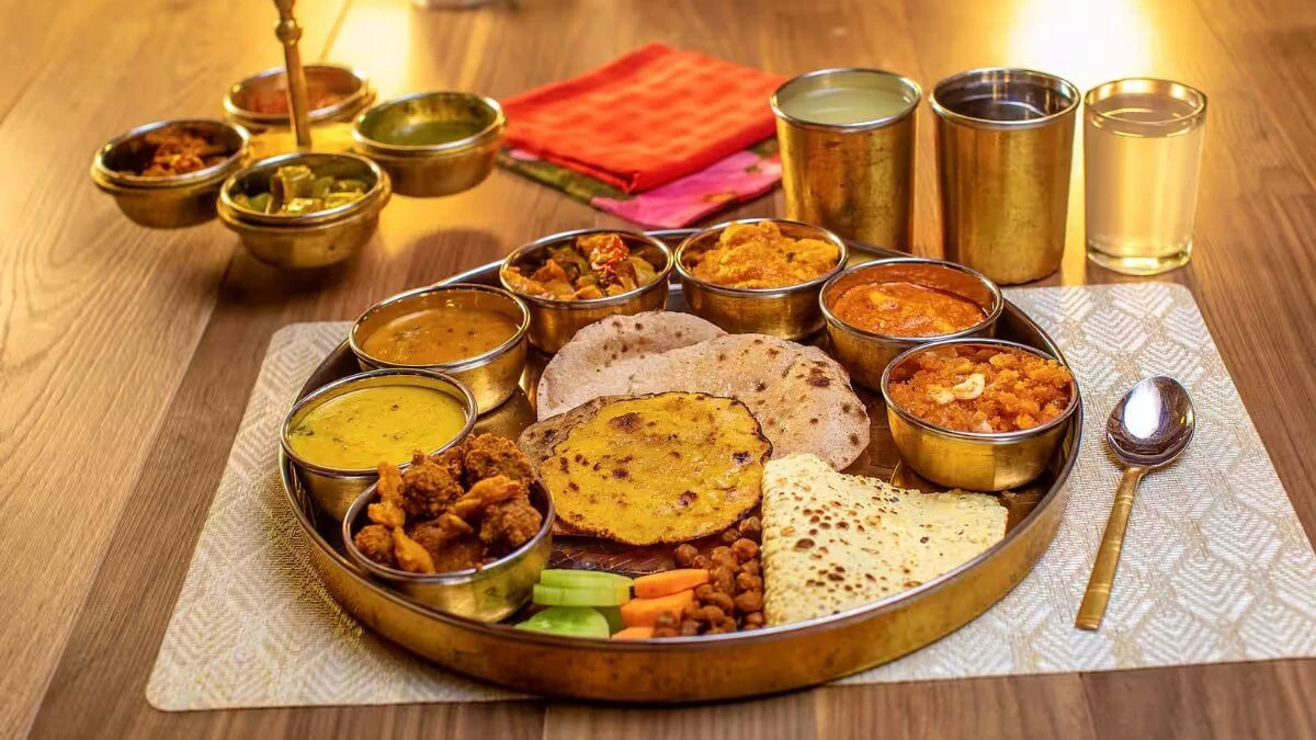 True health lies in the harmonious union of body, senses, mind, and soul. Understanding what supports or disrupts this balance is crucial for overall well-being. In Ayurveda, digestion is always the starting point for health, as your Agni (digestive fire) influences not only food digestion but also emotional and mental processes. Modern science may call the gut the "second brain," but Ayurveda considers it the first. And interestingly, you don't need expensive imported superfoods or trendy probiotic powders to support this vital system. The real gut-healers are already present in your kitchen-hidden in regional, traditional recipes that have stood the test of time, Inputs from Celebrity Ayurvedic Nutritionist Shweta Shah founder of Eatfit24/7 REGIONAL INDIAN FOODS AND THEIR DIGESTIVE BENEFITS Across India, each region boasts foods that serve as natural remedies for digestive health. In South India, dishes like idli and dosa are naturally probiotic, offering gentle, gut-friendly nutrition. Paired with coconut chutney, these foods help reduce inflammation, benefiting your digestive system. Moving towards Gujarat and Bengal, kanji (fermented rice or carrot water) acts as an ancient prebiotic drink that clears toxins (ama) from the body and supports healthy digestion. In Tamil Nadu, rasam is a medicinal concoction made from tamarind, pepper, garlic, and cumin, known for enhancing digestion and reducing bloating. This post-meal ritual aligns perfectly with Ayurvedic practices. Travelling north, sarson da saag with makki ki roti from Punjab is rich in fiber and chlorophyll, which supports liver detoxification when paired with ghee and jaggery. Maharashtra's amti, varan, and tak (buttermilk) offer calming benefits to the gut, thanks to soothing spices like hing and jeera that help ignite Agni without being harsh. THE IMPORTANCE OF SEASONAL EATING (RITUCHARYA) A crucial yet often overlooked Ayurvedic principle is Ritucharya, or seasonal eating. Ayurveda recommends aligning your diet with the changing seasons to protect your digestive health. During the monsoon, light, warm, and spiced foods are recommended to avoid waterborne imbalances. In summer, staying hydrated with raw mango, kokum, and buttermilk is essential for cooling the body, while winter allows for heavier grains and fats to build ojas (vitality). THE ROLE OF GRAINS IN GUT HEALTH Grains also play a significant role in maintaining gut health. Kolam rice, red rice, and Shreedhanya millets like kodo, barnyard, and little millet are light, non-mucous forming, and ideal for better digestion. Unlike refined grains, these grains feed your gut microbes, reducing bloating, acidity, and constipation. Rotating these grains weekly provides variety, nourishes your body, and keeps your Agni (digestive fire) strong and effective. Modern plant-based diets become truly healing when grounded in ancestral wisdom. Instead of chasing imported superfoods, reconnect with your roots. Your gut isn't confused; your lifestyle is. The best "plant-based" plan for digestion is already present on your plate-seasonal, regional, simple, and sattvic. Listen to your gut, nourish it properly, and it will reward you with balance and vitality across every aspect of your life. Read |